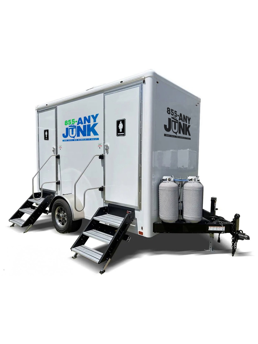 Premium portable restroom rental set up at an outdoor wedding venue.